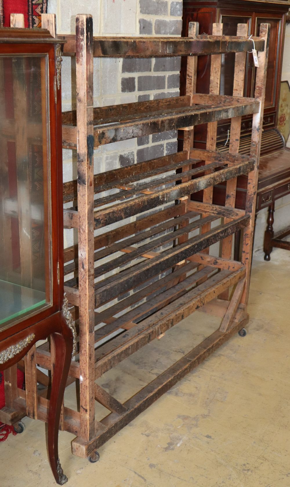 A vintage French pine bakers rack, W.124cm, D.38cm, H.143cm